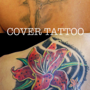 Copertura di un vecchio tatuaggio con 2 pesci e un fiore